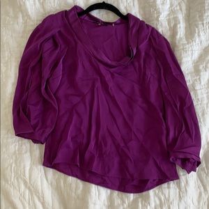 Top with slit detail on arms and silk neckline